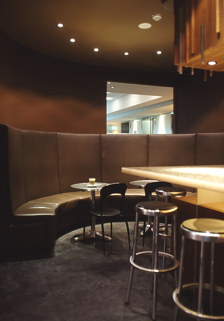 Iffy Cafe 04_curved leather banquette seating area_Stephen Varady Photo ©